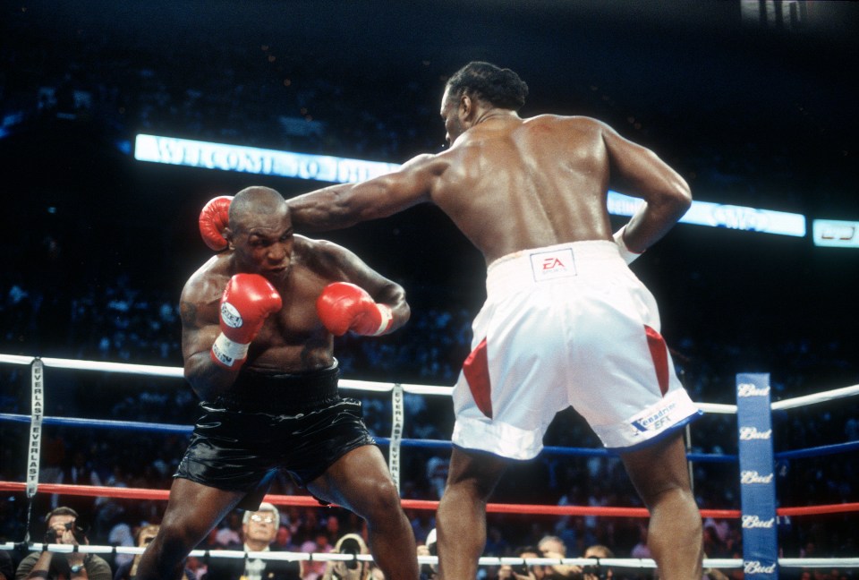 MEMPHIS, TN - JUNE 8:  Lennox Lewis and Mike Tyson fight for the WBC, IBO, IBF, Ring and Lineal heavyweight titles on June 8, 2002 at The Pyramid in Memphis, Tennessee. Lewis won the fight with an 8th round KO. (Photo by Focus on Sport/Getty Images)